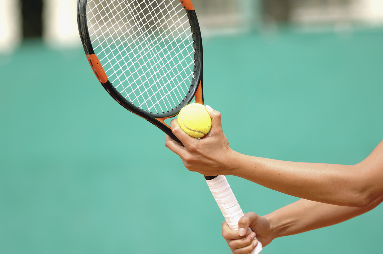 Tennis Player Preparing to Serve --- Image by © Royalty-Free/Corbis