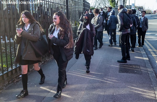 Pupils of a secondary school going home after school