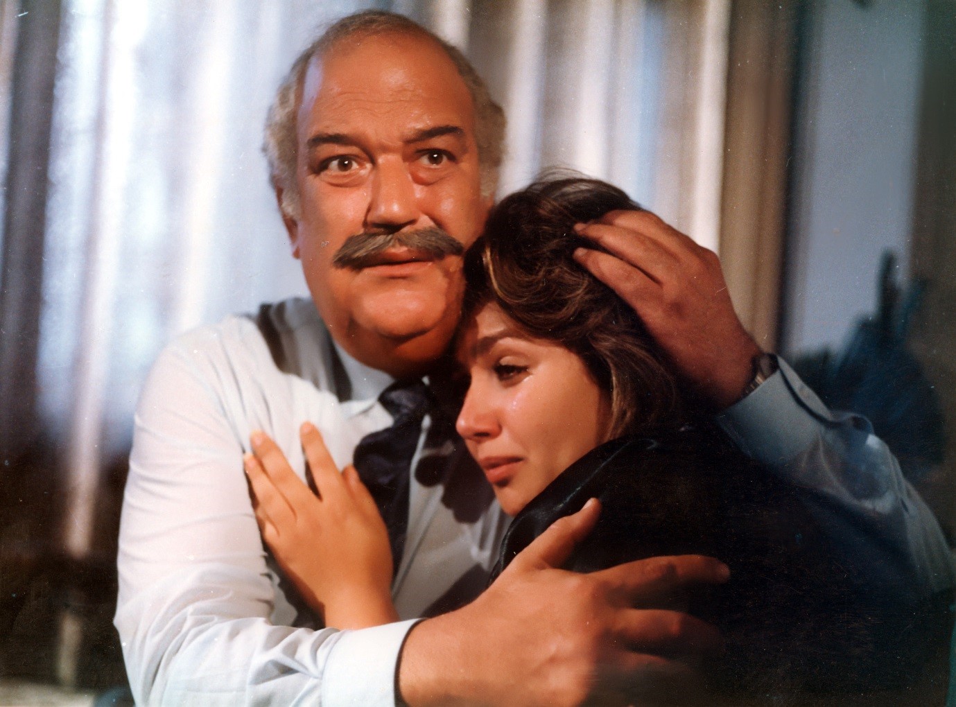 Safa (Leila Elwi) seeking refuge in her father’s (Hassan Hosni) arms (The Rapists, 1989)