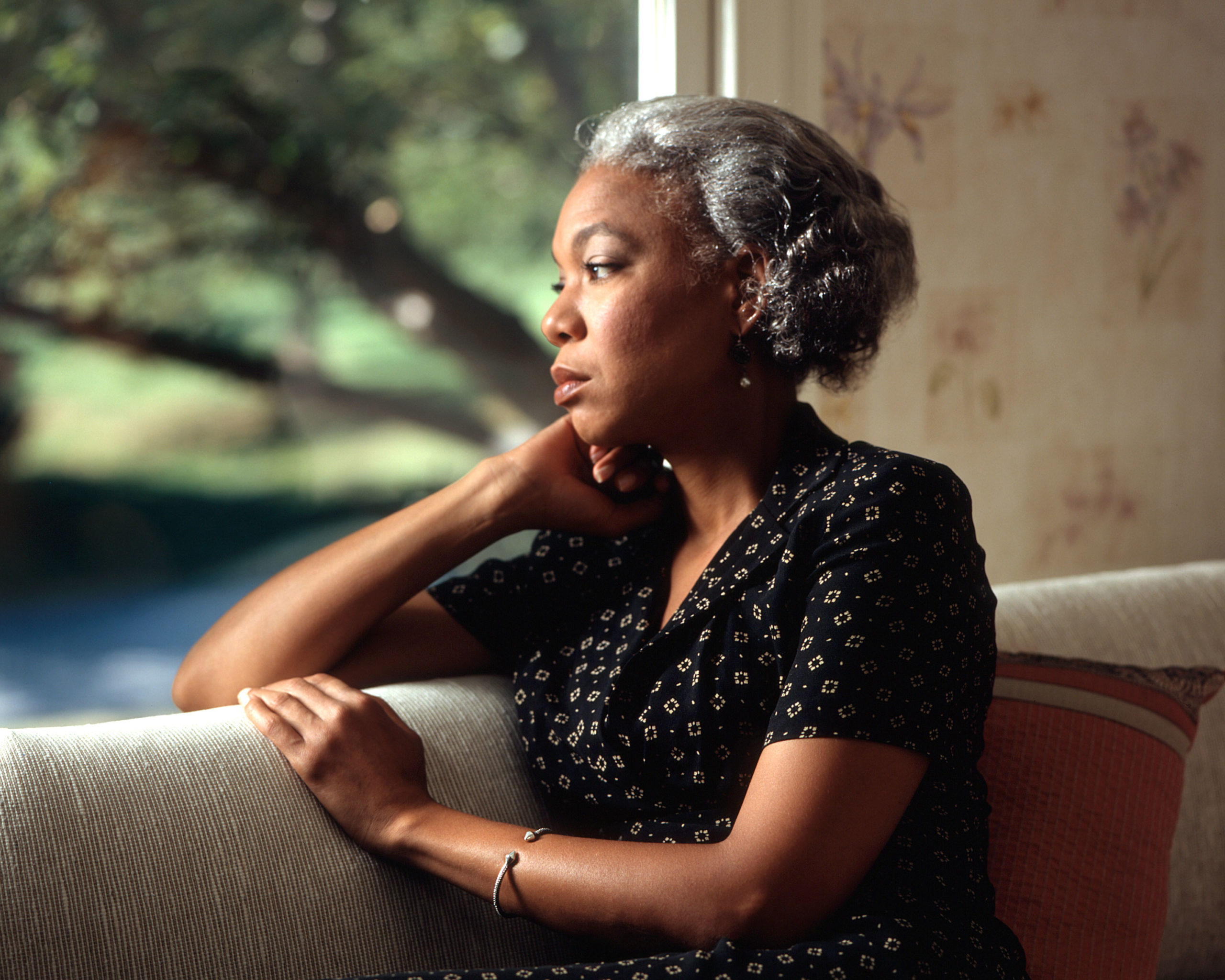  An African-American woman looking out a window