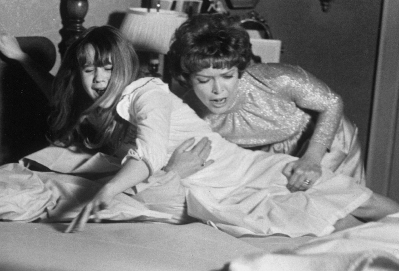 Publicity Still from The Exorcist taken 1974 in public domain showing Linda Blair and Ellen Burstyn. 