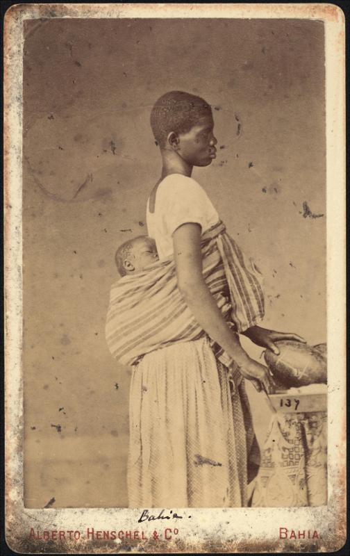 “An enslaved woman with a sleeping child on her back,” Bahia, Brazil, 1869 circa. Public domain images sourced from the collection of Leibniz-Institut fuer Laenderkunde, Leipzig/ Instituto Moreira Salles.