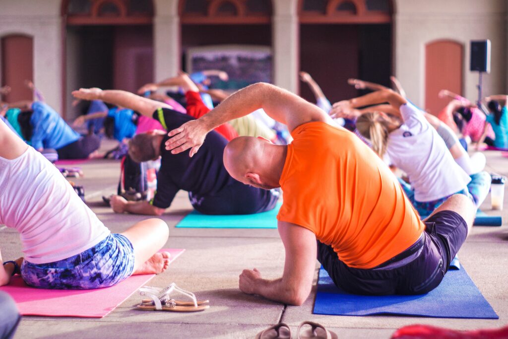 This image shows a group of people doing yoga